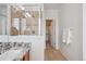 The tiled stand-up shower is visible from the granite countertop vanity at 8962 E Otero Pl, Centennial, CO 80112