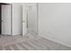 Neutral bedroom with plush carpeting, two doors, and white walls, creating a blank canvas at 8962 E Otero Pl, Centennial, CO 80112