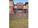 Attractive townhouse with brick facade, balcony and landscaped front yard at 8962 E Otero Pl, Centennial, CO 80112