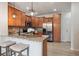 Updated kitchen with granite counters, stainless steel appliances, a breakfast bar and stylish pendant lighting at 8962 E Otero Pl, Centennial, CO 80112