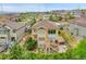 Aerial view of the home showcasing the deck, patio, lush landscaping and privacy in a suburban neighborhood at 24316 E Ottawa Ave, Aurora, CO 80016