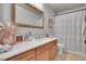 Bathroom featuring a white counter, white toilet, and decorative shower curtain at 24316 E Ottawa Ave, Aurora, CO 80016