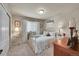 Cozy bedroom with floral bedding, side table, and a neutral-toned walls at 24316 E Ottawa Ave, Aurora, CO 80016