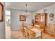 Well-lit dining room featuring hardwood floors, chandelier, and classic decor at 24316 E Ottawa Ave, Aurora, CO 80016
