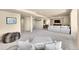 Expansive living area with a large seating area, a TV, and an open-concept design, perfect for entertaining at 24316 E Ottawa Ave, Aurora, CO 80016