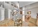 Open concept living room flows to staircase and dining room at 24316 E Ottawa Ave, Aurora, CO 80016