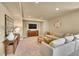 Cozy living room features recessed lighting, a neutral color palette, and comfortable seating at 24316 E Ottawa Ave, Aurora, CO 80016