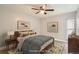 Cozy staged bedroom with a comfortable bed, modern decor and a soothing color palette at 3663 S Sheridan Blvd # J12, Denver, CO 80235