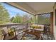Cozy staged patio with comfortable seating and a view of the outdoors at 3663 S Sheridan Blvd # J12, Denver, CO 80235