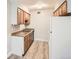 Functional kitchen featuring cabinets, double sink and refrigerator at 3663 S Sheridan Blvd # J12, Denver, CO 80235