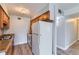 Efficient kitchen has a full-size refrigerator and gas range, with a laminate countertop at 3663 S Sheridan Blvd # J12, Denver, CO 80235