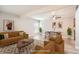 Well-staged living and dining space featuring modern décor and an inviting atmosphere at 3663 S Sheridan Blvd # J12, Denver, CO 80235