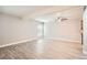 Expansive living room featuring hardwood floors, a ceiling fan, and natural light at 3663 S Sheridan Blvd # J12, Denver, CO 80235