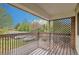 Covered patio with wooden deck overlooking the neighborhood at 3663 S Sheridan Blvd # J12, Denver, CO 80235