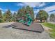 Community playground featuring modern equipment and safety surfacing at 3663 S Sheridan Blvd # J12, Denver, CO 80235