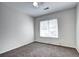 Bedroom with neutral colors and a large window with natural light at 10141 Autumn Blaze Trl, Highlands Ranch, CO 80129