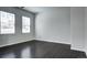 Minimalist bedroom features hardwood floors and two windows for plenty of natural light at 10141 Autumn Blaze Trl, Highlands Ranch, CO 80129