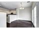 Bright dining area with modern lighting, hardwood floors, and access to a patio at 10141 Autumn Blaze Trl, Highlands Ranch, CO 80129