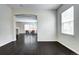 Bright living room featuring a fireplace, an archway, and hardwood floors at 10141 Autumn Blaze Trl, Highlands Ranch, CO 80129