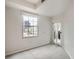 Bright bedroom features large windows and a door to a balcony at 300 W 11Th Ave # 5I, Denver, CO 80204