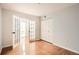 Spacious bedroom with wood floors, neutral paint, and French-style doors at 300 W 11Th Ave # 5I, Denver, CO 80204