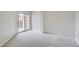 Bedroom with balcony and sliding glass door, filled with natural light at 300 W 11Th Ave # 5I, Denver, CO 80204