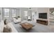 Bright living room features large windows, wood floors, and neutral decor at 300 W 11Th Ave # 5I, Denver, CO 80204