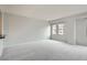 Bright and spacious living area with large windows and neutral walls at 300 W 11Th Ave # 5I, Denver, CO 80204