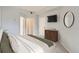 Well-designed bedroom includes a dresser, TV, and multiple closet and door entrances at 300 W 11Th Ave # 5I, Denver, CO 80204