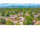 Overhead view of homes in a lush neighborhood setting, mountains in the background at 7591 S Reed Ct, Littleton, CO 80128