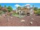 Spacious backyard with a pergola-covered patio, green lawn, and play area, perfect for outdoor enjoyment at 7591 S Reed Ct, Littleton, CO 80128