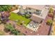 Aerial view of backyard with artificial grass and patio at 7591 S Reed Ct, Littleton, CO 80128