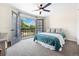 Bedroom with French doors to an outdoor balcony at 7591 S Reed Ct, Littleton, CO 80128