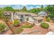 Charming two-story home featuring landscaped front yard and a two-car garage at 7591 S Reed Ct, Littleton, CO 80128