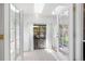 Bright sun room with sliding doors leading to the backyard, providing natural light and backyard access at 7591 S Reed Ct, Littleton, CO 80128