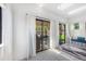Bright sun room with sliding doors and skylights offering natural light and a seamless connection to the outdoors at 7591 S Reed Ct, Littleton, CO 80128