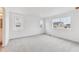 Bright bedroom with plush carpet and large windows offering ample natural light at 9692 Cathay St, Commerce City, CO 80022