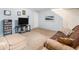 Finished basement area with comfortable seating and light blue painted walls at 9031 E Amherst Dr # D, Denver, CO 80231