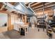 Unfinished basement with washer, dryer, storage and mechanical equipment at 9031 E Amherst Dr # D, Denver, CO 80231