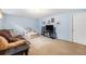 Finished basement area with comfortable seating and light blue painted walls at 9031 E Amherst Dr # D, Denver, CO 80231