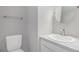 Well-lit bathroom features a round mirror and granite countertop at 9031 E Amherst Dr # D, Denver, CO 80231
