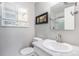 Clean bathroom with granite countertop, mirror and shower over tub at 9031 E Amherst Dr # D, Denver, CO 80231