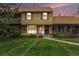 Charming townhome with a well-manicured lawn and inviting brick facade at 9031 E Amherst Dr # D, Denver, CO 80231