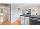 Convenient kitchen layout with stainless steel dishwasher, next to the dining area at 9031 E Amherst Dr # D, Denver, CO 80231