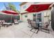 An outdoor patio with an umbrella, table, and seating creates a relaxing atmosphere at 9031 E Amherst Dr # D, Denver, CO 80231