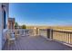 Relax on the back deck with chairs and enjoy the open field view at 9373 Pitkin St, Commerce City, CO 80022