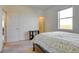 Bright bedroom with large window and spacious closet featuring neutral carpet at 9373 Pitkin St, Commerce City, CO 80022