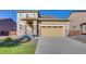Charming home featuring stone accents on the front porch and a two-car garage at 9373 Pitkin St, Commerce City, CO 80022