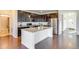 Modern kitchen with stainless steel appliances, granite countertops, and ample cabinet space at 9373 Pitkin St, Commerce City, CO 80022