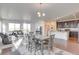 Spacious living area combined with a dining space and a modern kitchen, perfect for entertaining at 9373 Pitkin St, Commerce City, CO 80022